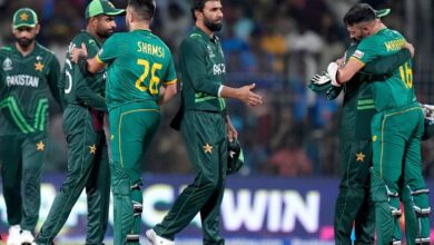 South Africa's batters Keshav Maharaj and Tabraiz Shamsi meet Pakistan players after winning the ICC Men's Cricket World Cup 2023 match against Pakistan, at MA Chidambaram Stadium, in Chennai