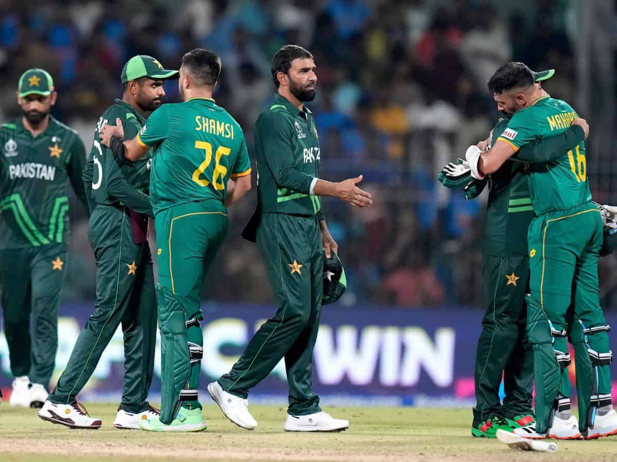 South Africa's batters Keshav Maharaj and Tabraiz Shamsi meet Pakistan players after winning the ICC Men's Cricket World Cup 2023 match against Pakistan, at MA Chidambaram Stadium, in Chennai