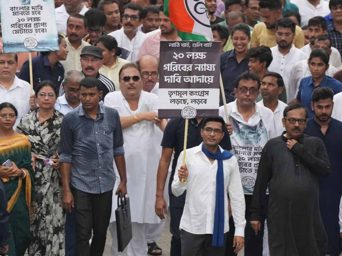 TMC general secretary Abhishek Banerjee with party activists during protest march towards West Bengal Governor house, in Kolkata