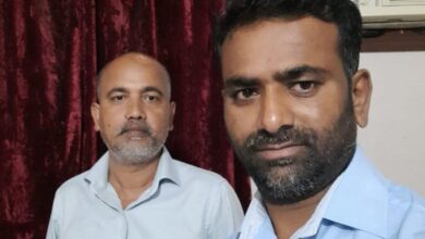 Kondadam Krishna (right), Khursheed Ahmed (left)