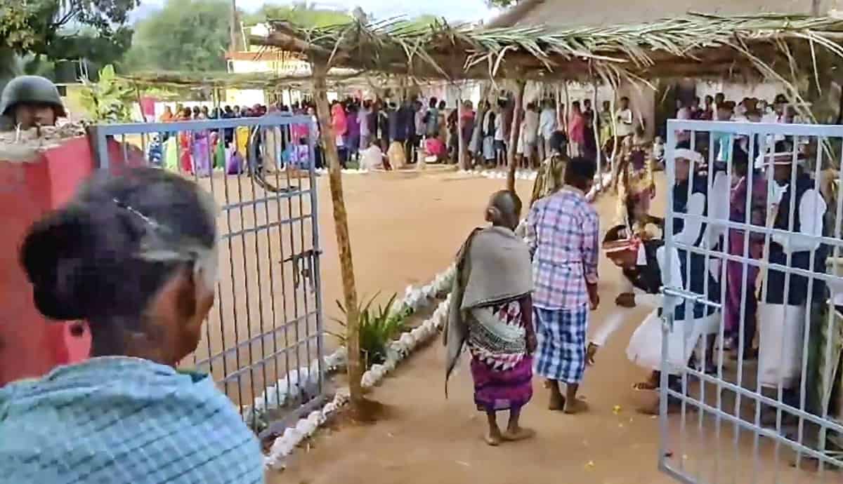 **EDS: GRAB VIA PTI VIDEO** Kanker: Voters being welcomed as they arrive to cast their votes for the 1st phase of Chhattisgarh Assembly elections, at a polling station in Kanker district, Tuesday, Nov. 7, 2023. (PTI Photo)(PTI11_07_2023_000069B)