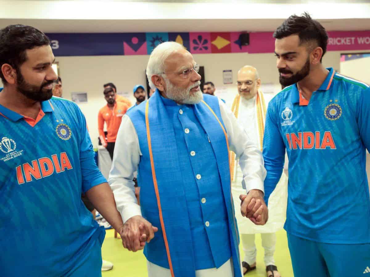 Ahmedabad, Nov 20 (ANI): Prime Minister Narendra Modi consoles cricketers Rohit Sharma and Virat Kohli as the PM meets the players of Team India in their dressing room to raise their spirits after India's loss to Australia by 6 wickets in the ICC Men's Cricket World Cup 2023 final match at Narendra Modi Stadium in Ahmedabad recently. Australia win their sixth ICC ODI World Cup title. Union Home Minister Amit Shah also seen. (ANI Photo)