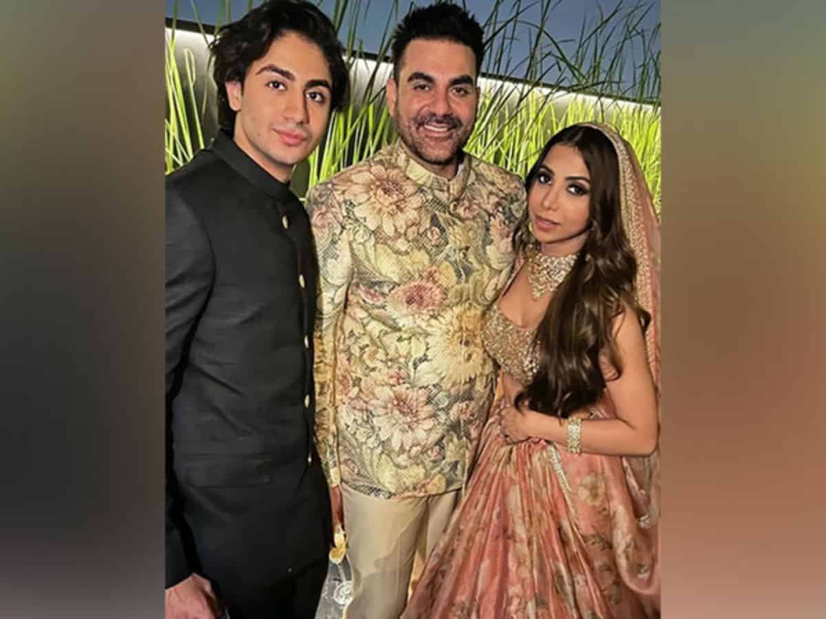Newlyweds Arbaaz, Shura pose with son Arhaan at wedding ceremony