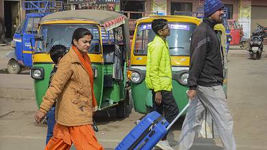 Ranchi: Passengers walk with their belongings as they try to reach their destination amid a strike of buses and trucks, in Ranchi, Tuesday, Jan. 2, 2024. Buses and trucks keept off the roads as drivers protested against stricter punishments in the new law on hit-and-run cases. (PTI Photo)(PTI01_02_2024_000187B)