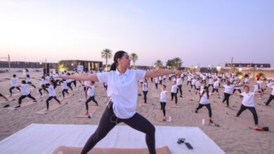 Emirates employees set yoga world record in Dubai desert