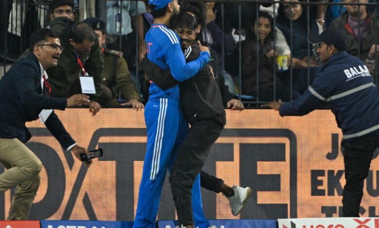 Man hug Virat Kohli during T20 match