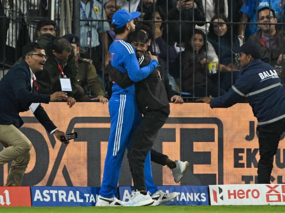 Man hug Virat Kohli during T20 match