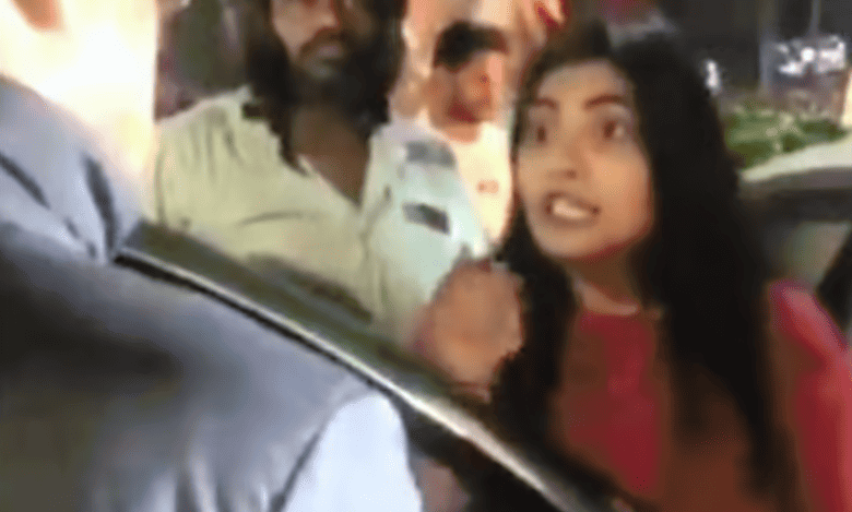 Video: Woman assaults traffic home guard in Banjara Hills