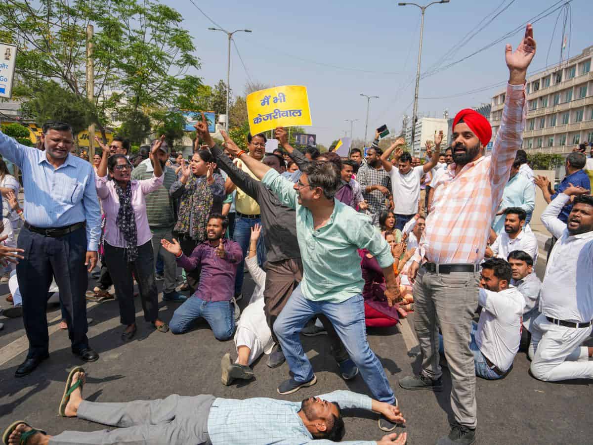 AAP workers block a road during a protest