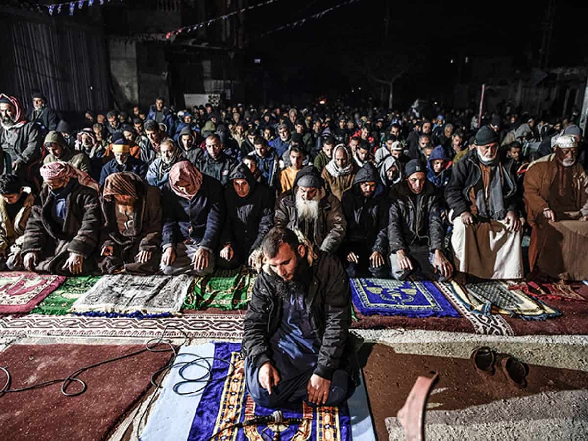 Palestinians perform Taraweeh prayers at destroyed Al-Farouq Mosque in Gaza