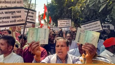 Hindu and Sikh refugees raise slogans during a protest against Delhi Chief Minister Arvind Kejriwal