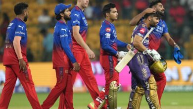 Kolkata Knight Riders' Rinku Singh being congratulated by Royal Challengers Bengaluru's players