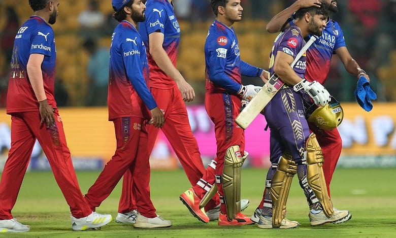 Kolkata Knight Riders' Rinku Singh being congratulated by Royal Challengers Bengaluru's players