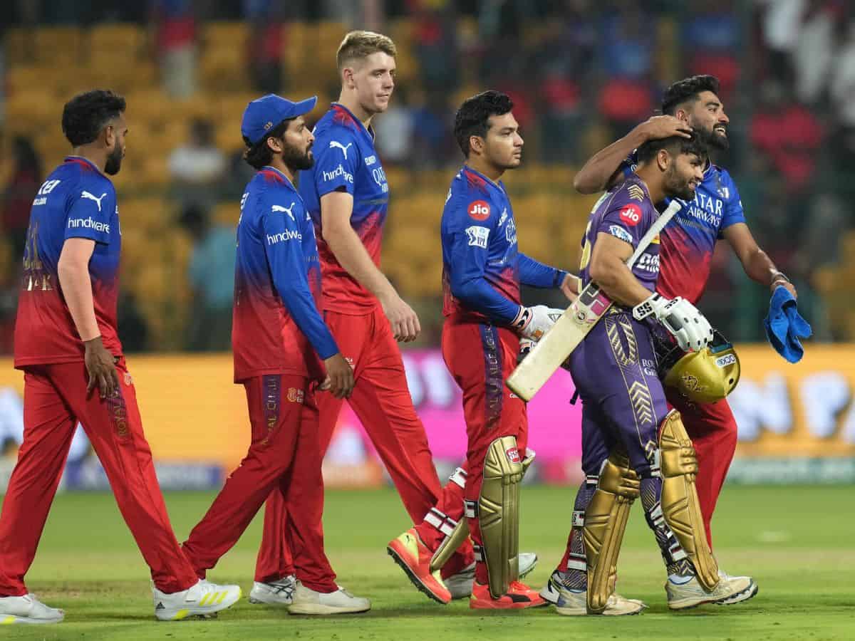 Kolkata Knight Riders' Rinku Singh being congratulated by Royal Challengers Bengaluru's players