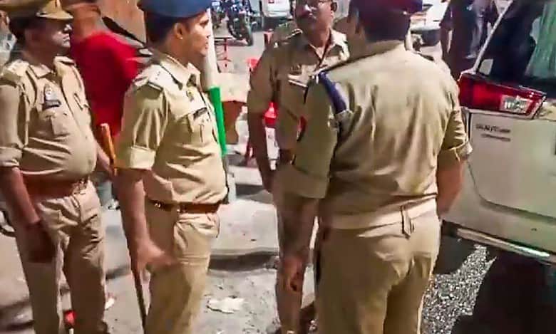 Security personnel stand guard following the death of jailed gangster-turned-politician Mukhtar Ansari, in Mau,