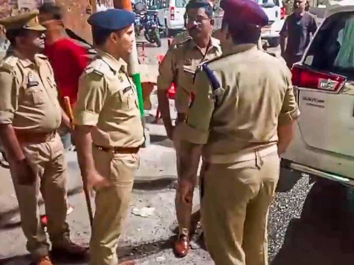 Security personnel stand guard following the death of jailed gangster-turned-politician Mukhtar Ansari, in Mau,