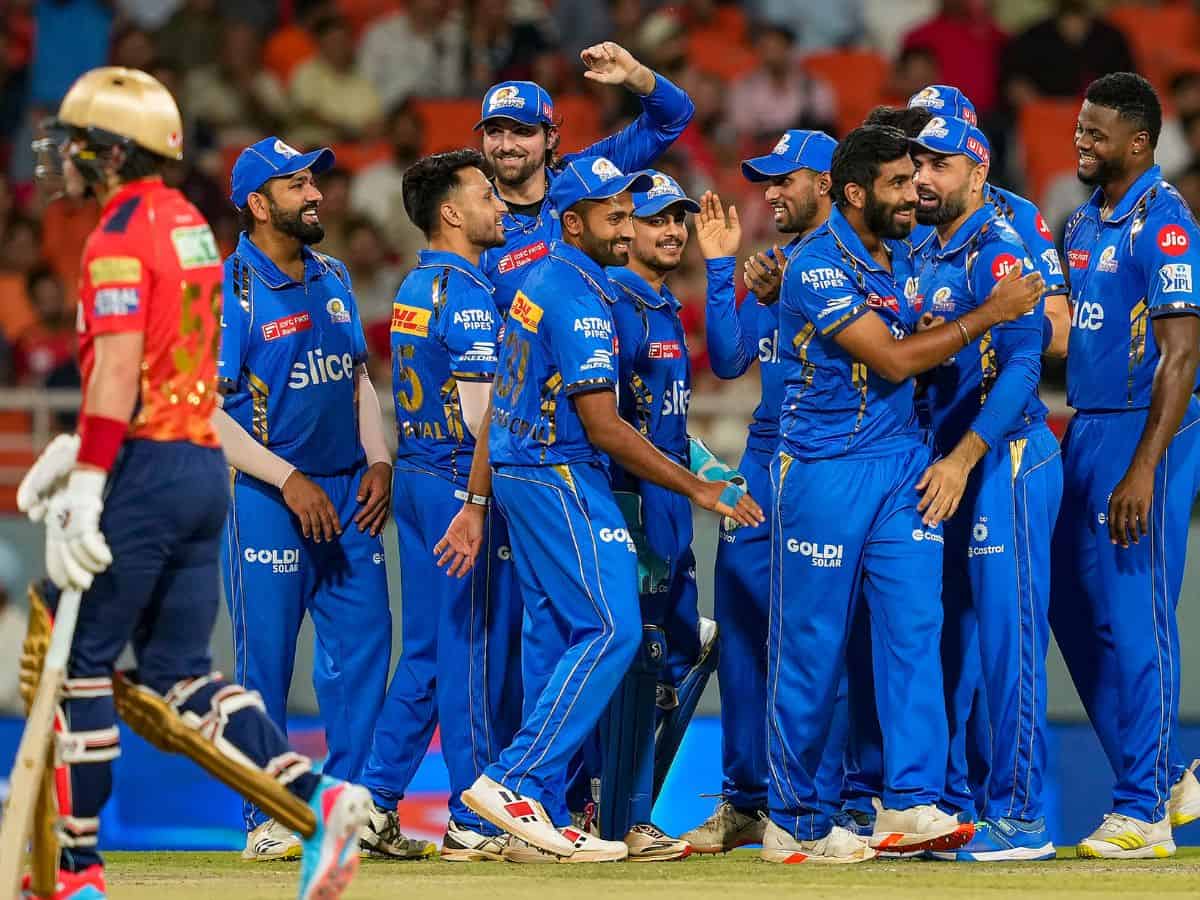 Mohali: Mumbai Indians bowler Jasprit Bumrah with teammates celebrates the wicket of Punjab Kings batter Sam Curran during the Indian Premier League (IPL) 2024 cricket match between Punjab Kings (PBKS) and Mumbai Indians (MI) at Maharaja Yadavindra Singh International Cricket Stadium, Mullanpur, in Mohali, Thursday, April 18, 2024. (PTI Photo)