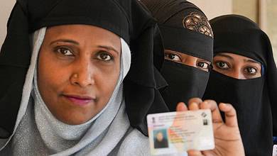 Burqa clad woman at a polling station