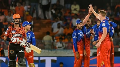 Royal Challengers Bengaluru players celebrate the wicket of Sunrisers Hyderabad batter Bhuvaneshwar Kumar during the Indian Premier League (IPL) 2024 match between Sunrisers Hyderabad and Royal Challengers Bengaluru, at Rajiv Gandhi International Cricket Stadium, in Hyderabad