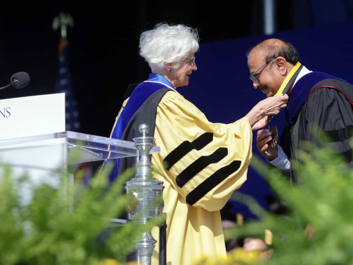 Dr. Krishna Ella Receiving Johns Hopkins Bloomberg School The Dean's Medal from Dean Ellen J. MacKenzie, for his exceptional leadership in safeguarding and improving global public health