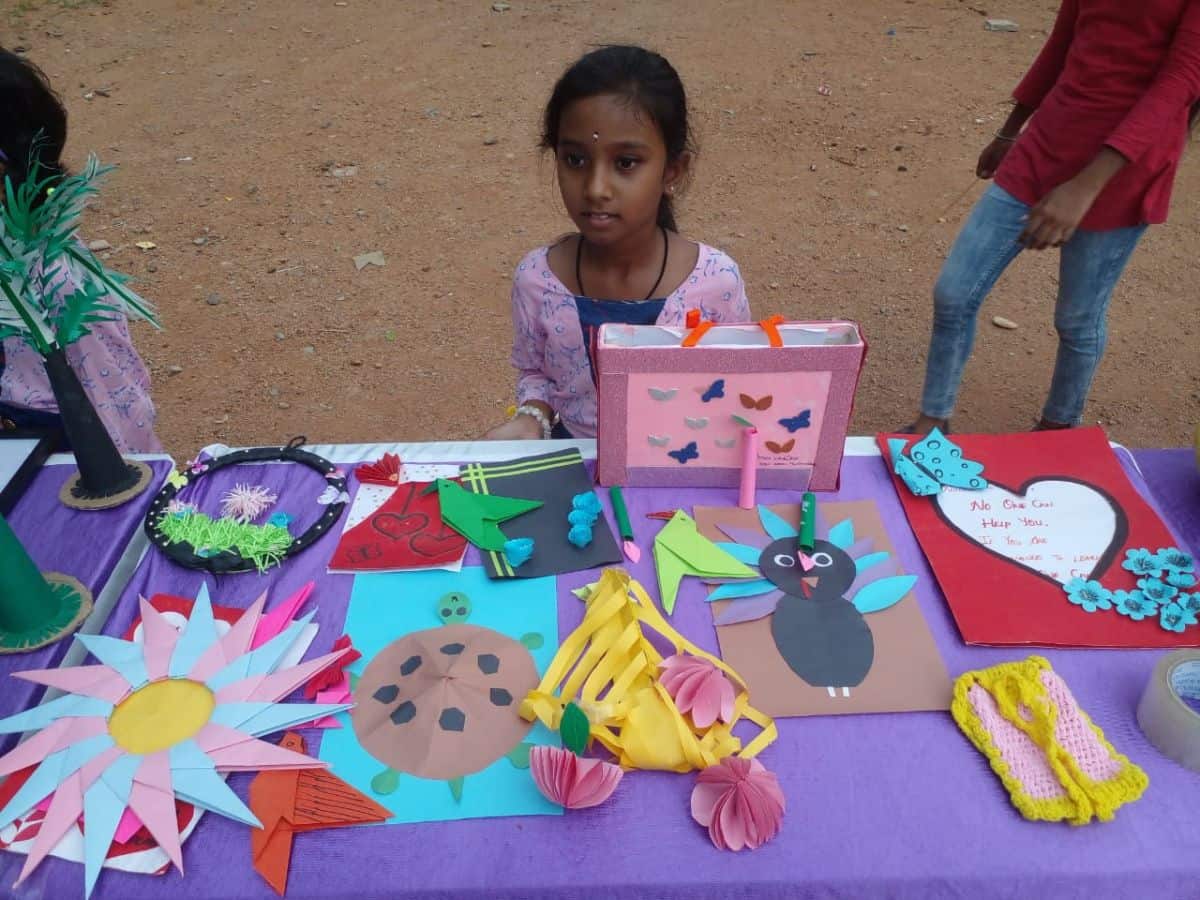 A girl child of Aman Vedika showcases their art and craft models at the concluding ceremony of their summer camp at Musheerabad Government High School last week.