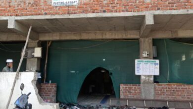 GHMC demolishes the boundary wall of Masjid-e-Habeeb Unnisa located at HMT Maqtha in Miyapur village of Serilingampally mandal using a bulldozer on Tuesday
