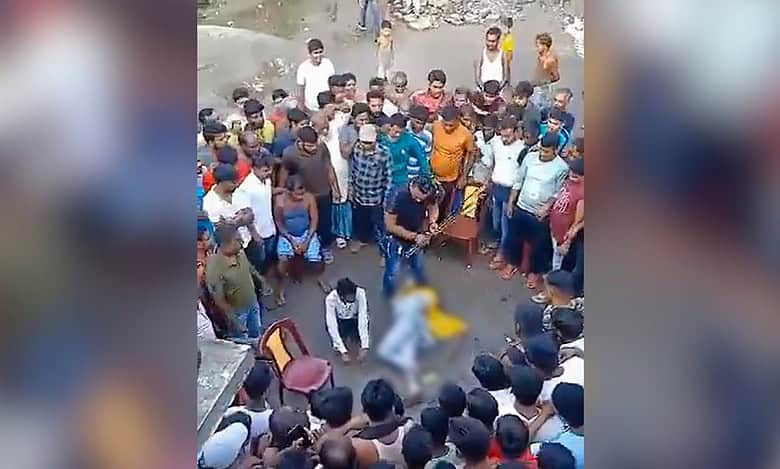 A couple allegedly engaged in an illicit relationship being assaulted by an alleged TMC leader