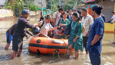 Nagaon: People walk through a flooded area following rains, at Kampur, in Nagaon district, Assam, Thursday, June 20, 2024. (PTI Photo)