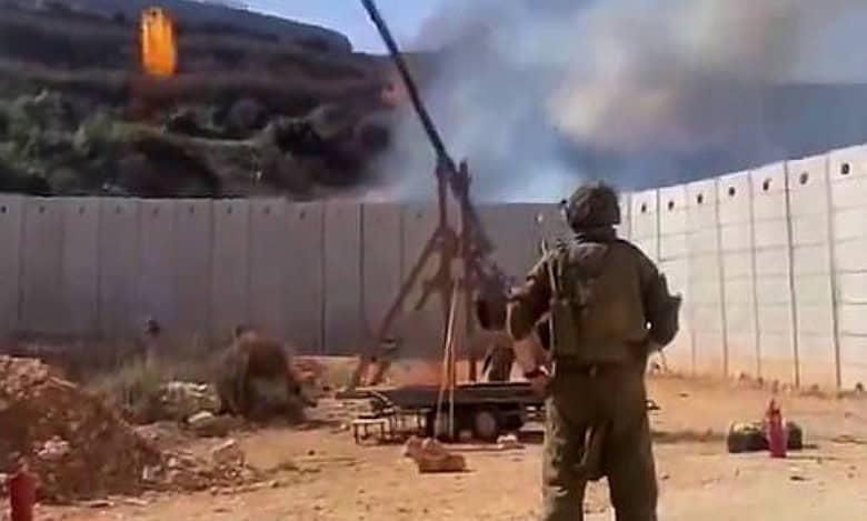 Israeli soldiers uses catapult to launch fireball into Lebanon