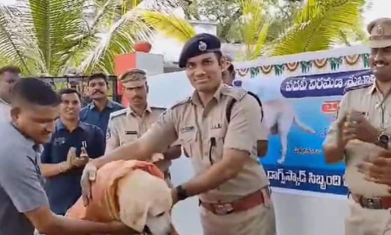 Adilabad SP Gaush Alam felicitates police sniffer canine Tara on her retirement from 12 years of service.