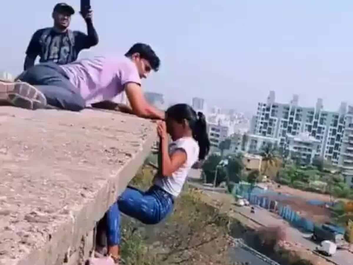 Girl dangles mid-air for reel, Pune Police nab 2 for daredevil stunt