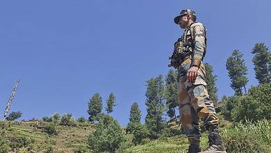 Doda: A security personnel stands guard during an anti-terror operation after four Army personnel, including an officer, died after being injured in a gunfight with terrorists, in Doda district of Jammu and Kashmir, Tuesday, July 16, 2024. (PTI Photo)(PTI07_16_2024_000026B)