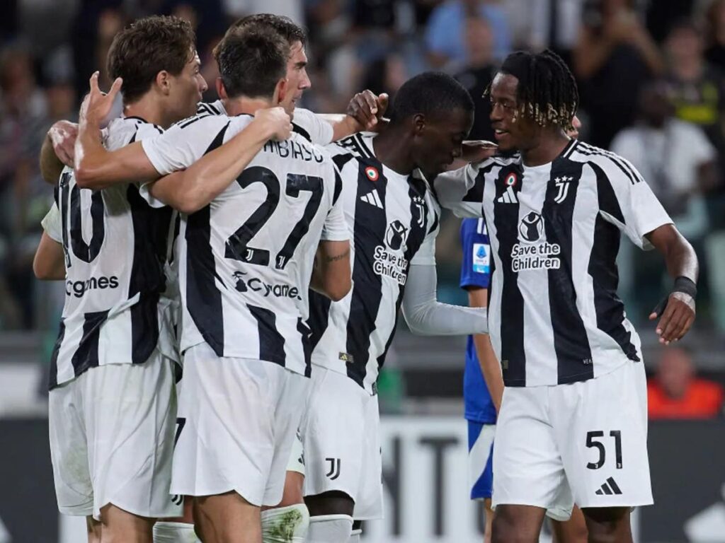 Juventus players celebrate their goal against Como