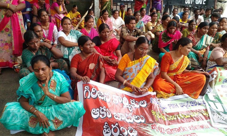 Adivasi PMH workers protested at the tribal welfare department's office demanding payment of their pending salaries.