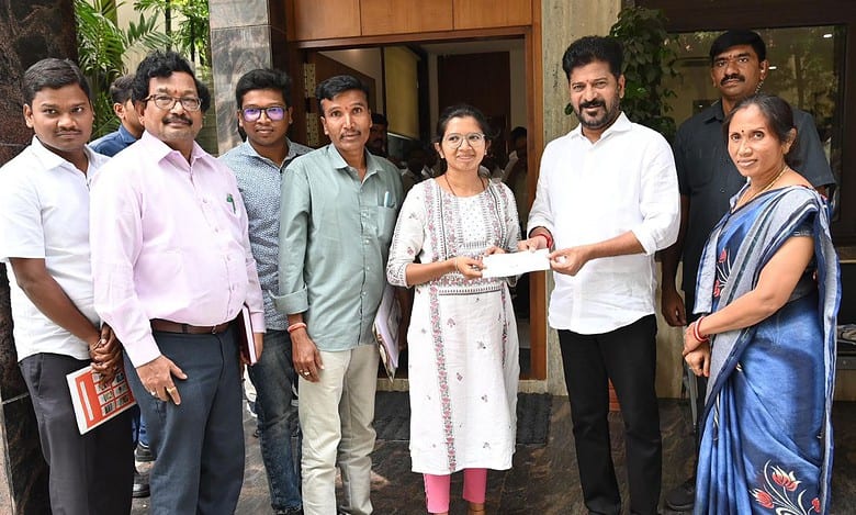 Chief Minister Revanth Reddy handing over financial assistance to Sai Shraddha for her MBBS education