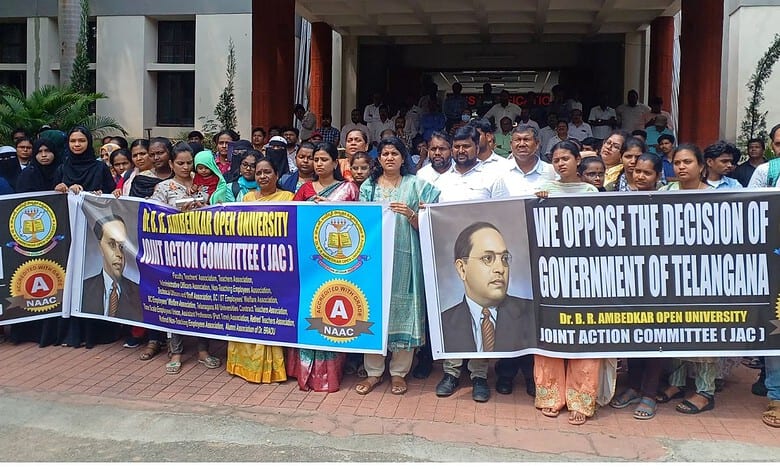 BRAOU teaching and non-teaching staff protest against the state government's plans to give its campus land to JNAFAU..