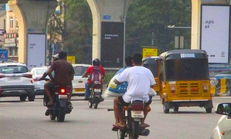 Traffic police fine helmet rule violators in Hyderabad’s Bandlaguda