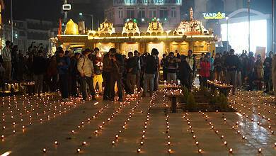 People decorate the premises of the temple with lights (Photo: Muzamil Bhat/Siasat.com)