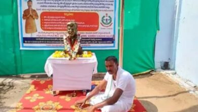 Former home guard protests at his residence in Bellampalli town along with chief minister A Revanth Reddy's statue demanding the reinstatement of his service.