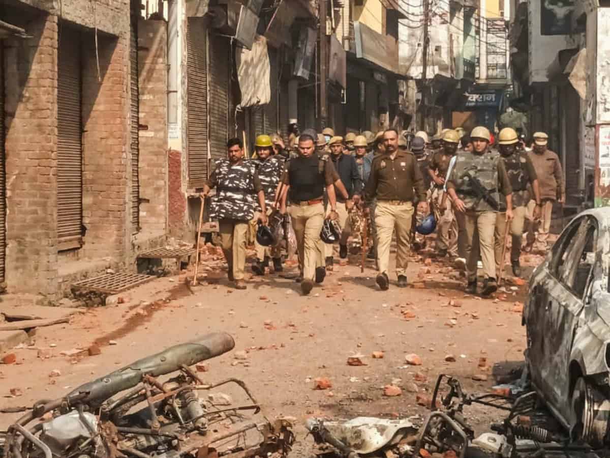Police and security personnel interact with locals protesting during a second survey of the Jama Masjid, claimed to be originally the site of an ancient Hindu temple