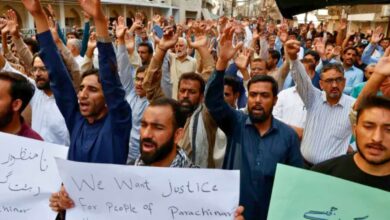 Pakistani Shia Muslim supporters of Majlis Wahdat-e-Muslimeen condemn the killings of people after gunmen opened fire on passenger vehicles in Kurram, in Karachi, Pakistan