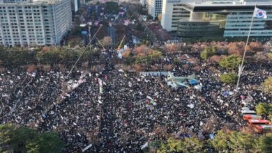 The streets of Seoul were packed with an estimated 145,000 protesters who erupted in cheers as parliament passed a vote to impeach Yeol