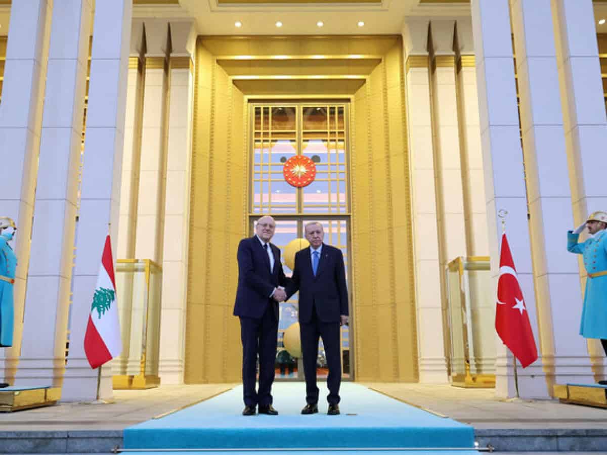 Turkey's President Tayyip Erdogan welcomes Lebanon’s caretaker Prime Minister Najib Mikati in Ankara, Turkey, on December 18.