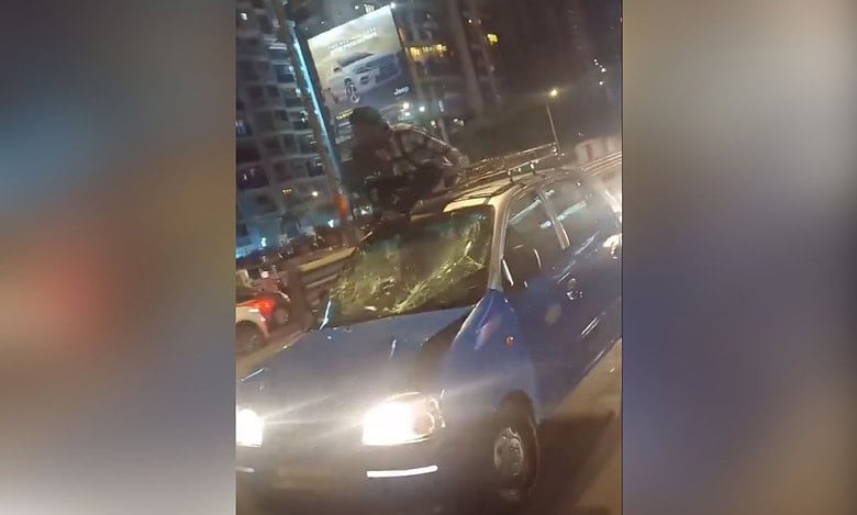 Video: Man Climbs Onto Taxi in Hit-and-Run Allegation