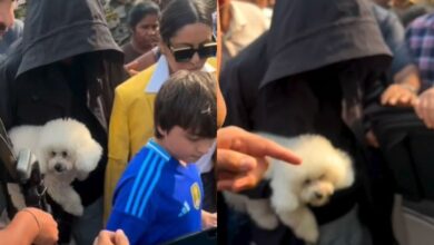 SRK tries to go incognito as he exits jetty with pet and family