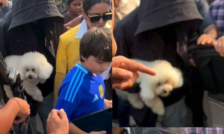 SRK tries to go incognito as he exits jetty with pet and family