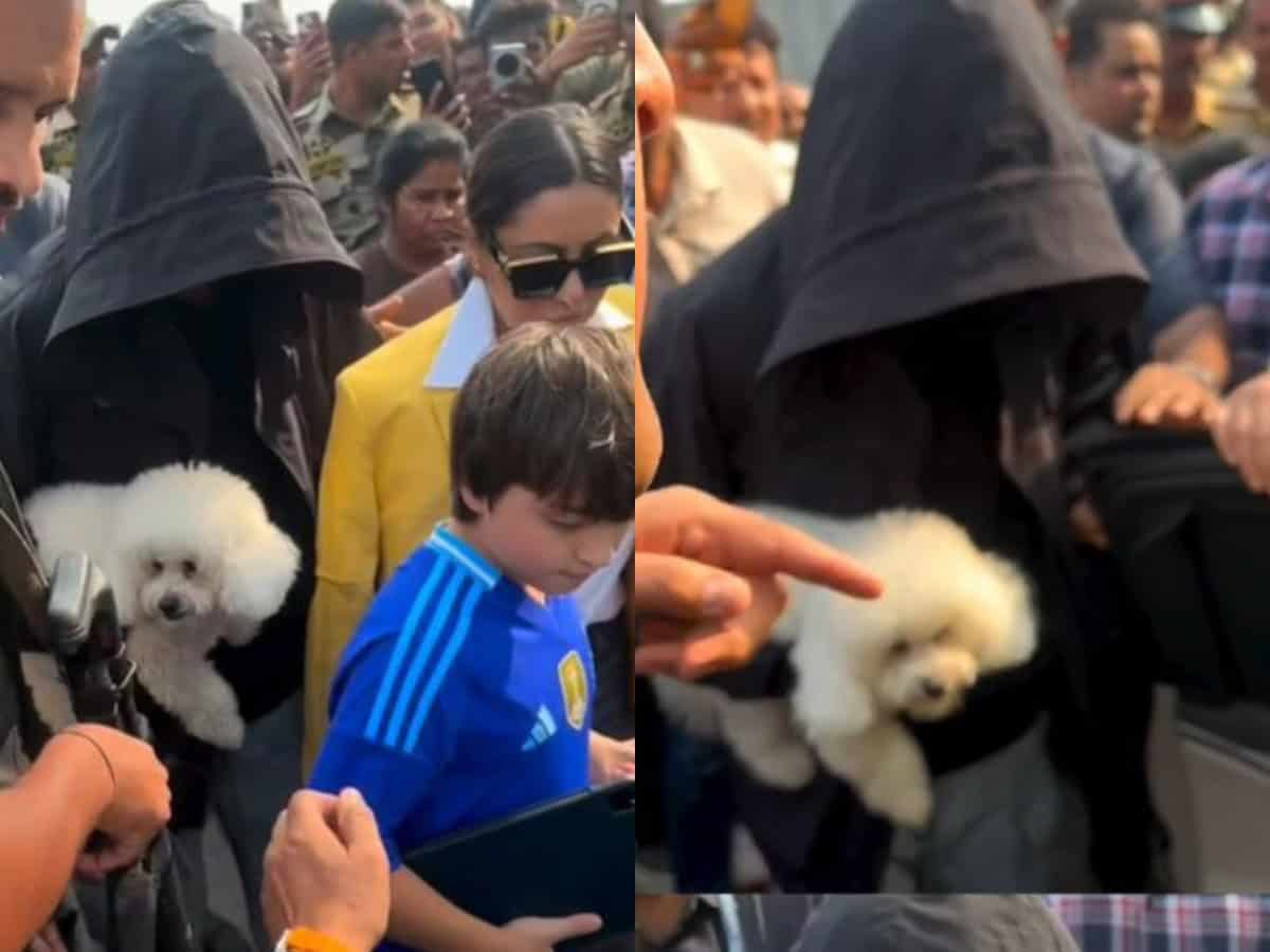 SRK tries to go incognito as he exits jetty with pet and family