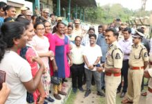 Image of Hyderabad police commissioner CV Anand speaking with newly recruited transgenders as traffic police assistants.