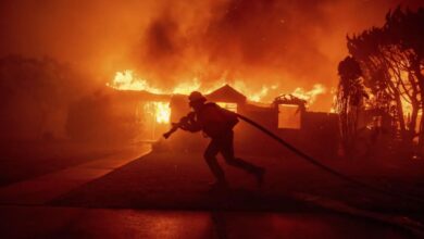 Wildfires burn out of control across Los Angeles area, kill 5 as thousands flee homes
