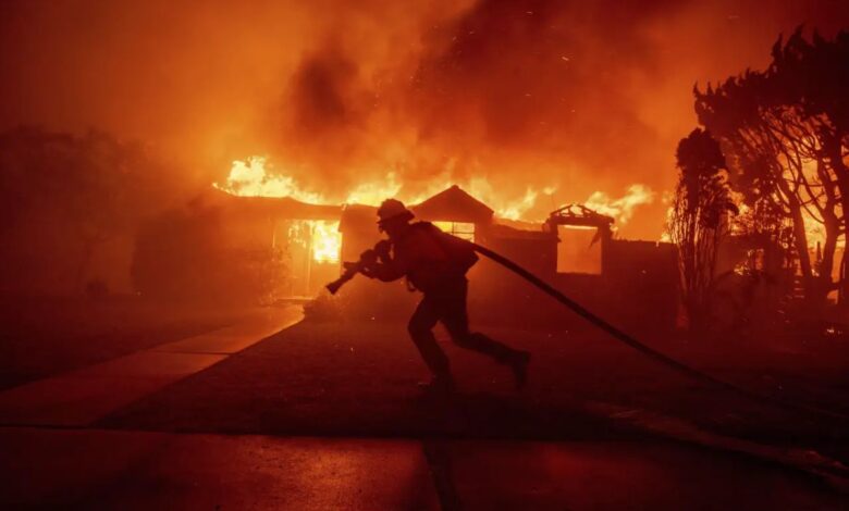 Wildfires burn out of control across Los Angeles area, kill 5 as thousands flee homes